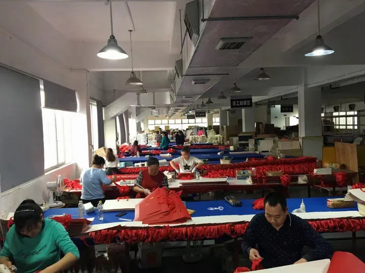Factory workers at production line